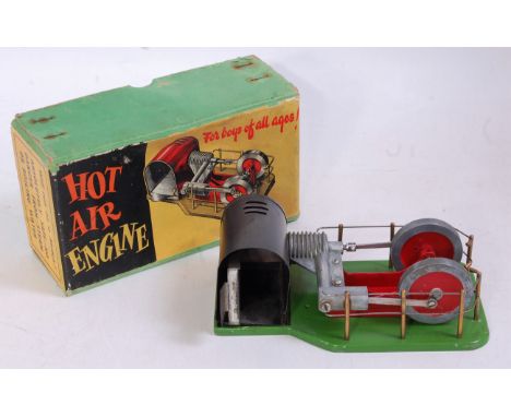 A Davies Charlton Ltd of the Isle of Man, boxed stationary hot air engine, finished in green and red with usual expected fitt
