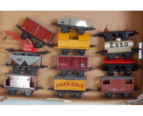 A large tray  containing 12 Hornby postwar wagons including No. 50 goods van, No. 1 BR open, No. 1 lumber, No. 1 crane truck,
