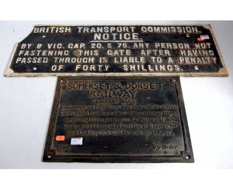 A British Transport Commission cast iron notice stating "Any person not fastening this gate after having passed through is li