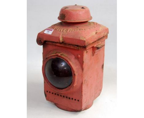 A heavy cast iron LNER gate lamp overpainted in red with lamp interior