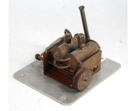 A proprietary scratch built brass steel and stainless steel constructed stationary steam engine, comprising twin horizontal b