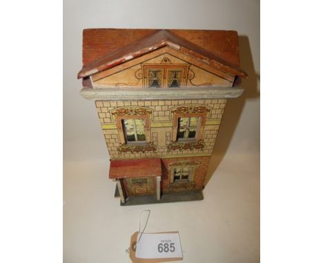 A small Moritz Gottschalk wooden framed red roof dolls house, with  2 levels, Circa 1915, with lithographed red brick and san