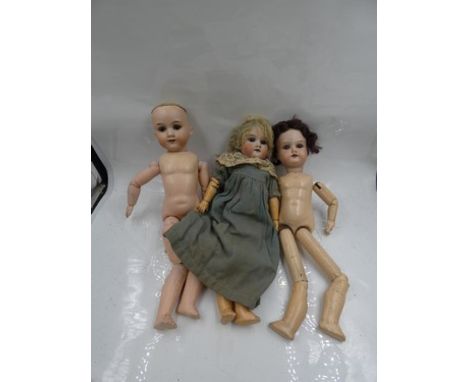 Three Armand Marseille bisque headed dolls, one with brown sleeping eyes, painted brown brows, open mouth with teeth, blonde 