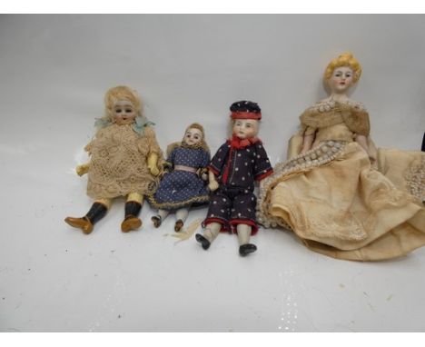 Four assorted dolls house dolls comprising one German bisque head doll, with blue sleeping eyes, open red mouth, painted feat