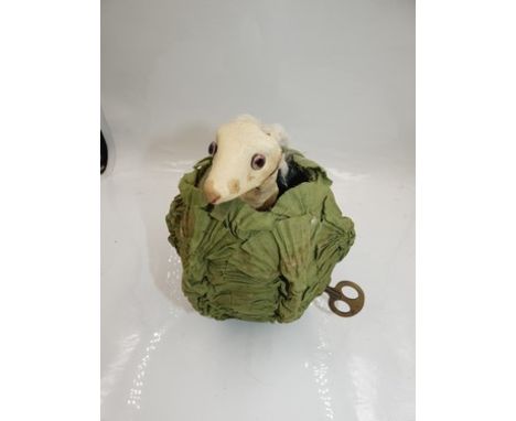 A Roullet &amp; Decamps rabbit in cabbage musical automation, with glass eyes, Papier-Mache cabbage covered in green fabric, 