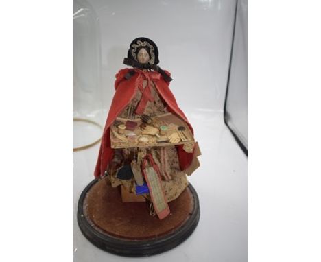 A 19th Century wooden Pedlar doll with black painted hair, painted eyes and lips, jointed body with red painted shoes, with r