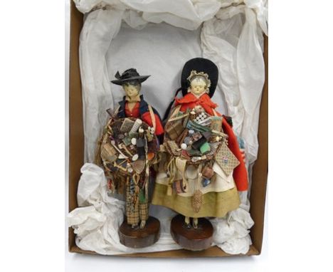 A 19th Century male Pedlar doll, with black painted hair, painted eyes and lips, rosy cheeks, jointed body. Dressed in check 