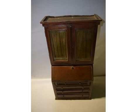 A quality 20th Century mahogany apprentice piece bureau bookcase with double door to top opening to two fitted shelves, doors