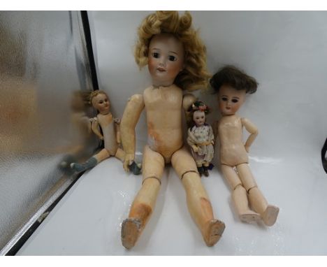 Four S.F.B.J French bisque headed dolls comprising a miniature doll with fixed brown eyes, painted brown brows and lashed, op