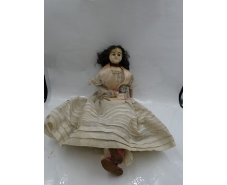 19th Century English wax shoulder head doll, with inset black eyes, red mouth and dark eyebrows, with dark brown ringlet wig,