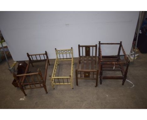 Four assorted wooden dolls beds and one wooden rocking cradle including one wooden slat bed (Provenance Phillips Lot 463 K140