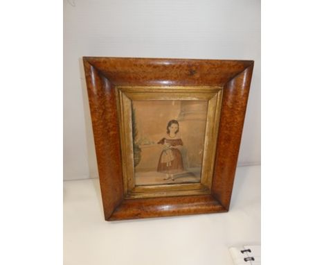 A Victorian naive watercolour depicting a young girl in a red dress holding her doll, unsigned, glazed, gilt surround and bur