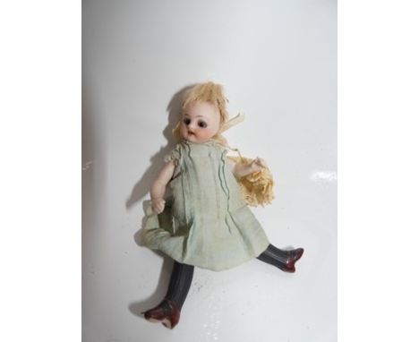 A German all bisque swivel head doll, with brown sleeping eyes, feathered brown brows, open mouth with two front teeth, blond