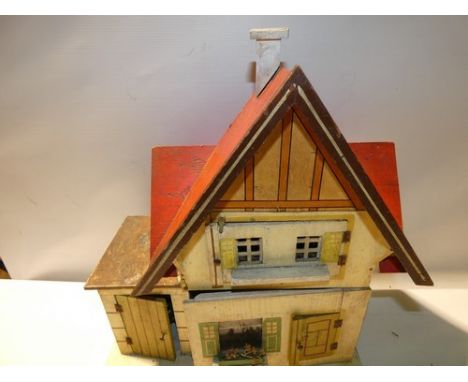 A Moritz Gottschalk wooden framed red roof dolls house with 2 levels, Circa 1915m with one glazed window and two open windows