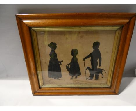 A Victorian silhouette depicting three children, one young girl holding a doll, a young girl holding a glove and a young boy 