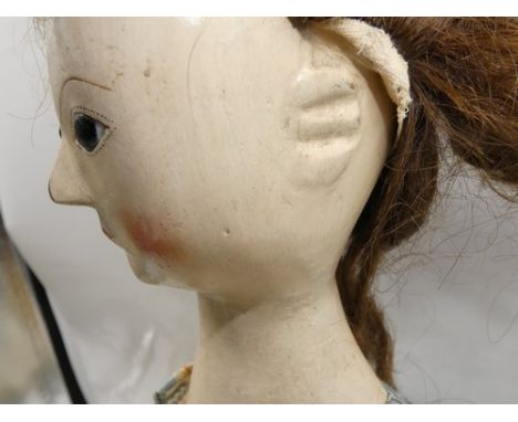 A rare 18th Century English gesso covered wooden doll, inset dark eyes, painted dotted eyelashes and eyebrows, red painted mo