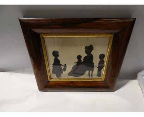 A Victorian silhouette depicting a family scene with a young girl holding a doll, a young boy with a whip and a young child s