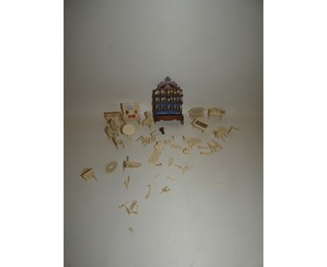 A good collection of dolls house miniature bone furniture including a piano etc.