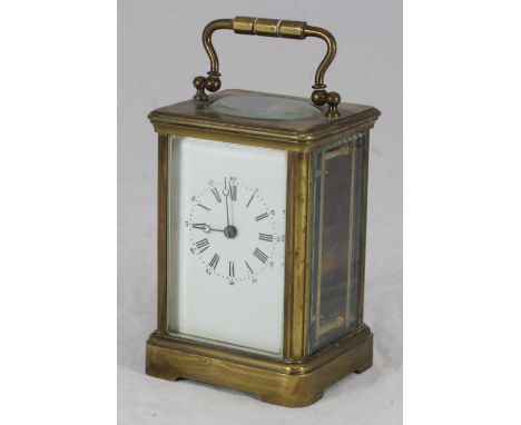 An early 20th century French brass carriage clock, with white enamel dial, 14cm high 