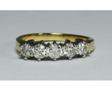 An 18ct gold five-stone diamond ring, claw-set five round brilliant-cut diamonds, each estimated 0.20pts / 1.00 carat in tota