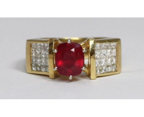 An 18 carat gold, ruby and diamond ring, centrally six-claw set a cushion-cut ruby, of good commercial colour, measuring appr