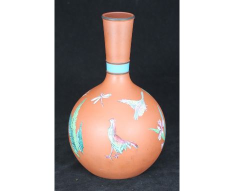 A Watcombe Pottery terracotta vase of shaft and globe form, the body painted with birds, insects and leaves, 26cm tall 