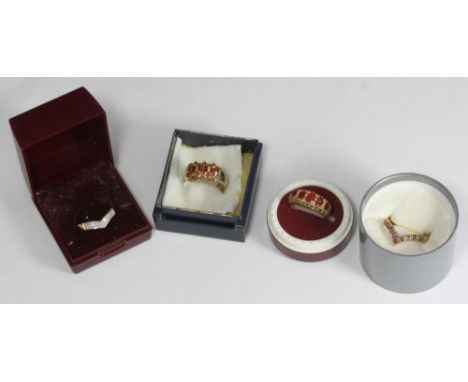 Two 9ct gold rings set with orange faceted gemstones, possibly Spessartite garnet or Topaz, together with a 9ct and ruby wish