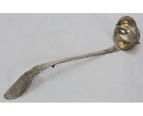 A white metal punch ladle or toddy spoon, with shaped bowl, (tests as silver), approx. 6.81 ozt 