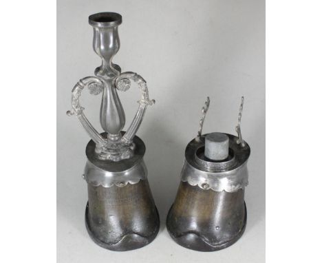 A pair of horse hooves mounted as an inkwell-pen stand and a candlestick 