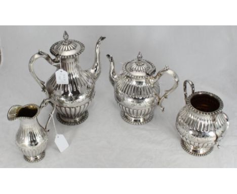 A four-piece silver-plated tea and coffee service, each piece decorated with a reeded and fluted design, with etched floral a