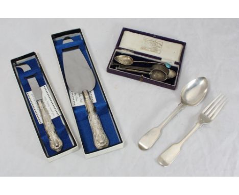 A Victorian silver fork and spoon, four various silver teaspoons, one with blue enamel finial inscribed 'E', and a silver-han