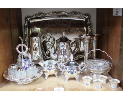 SECTION 29. Silver-plated wares including tea and coffee service, glass condiment set, serving dishes, napkin rings and a lar