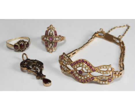 A gold and garnet coloured pierced closed-back pendant, possibly Georgian, together with a similar 8ct gold and garnet ring, 