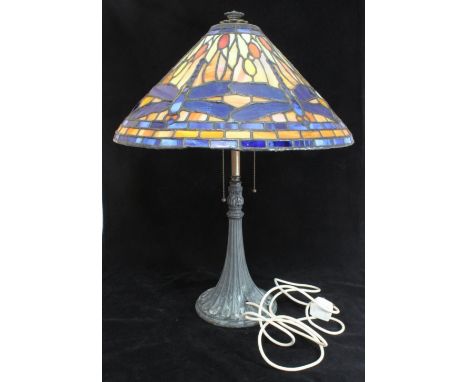 A large Tiffany style lamp with twin lights and individual metal pull cords, large shade with blue dragonflies and borders to