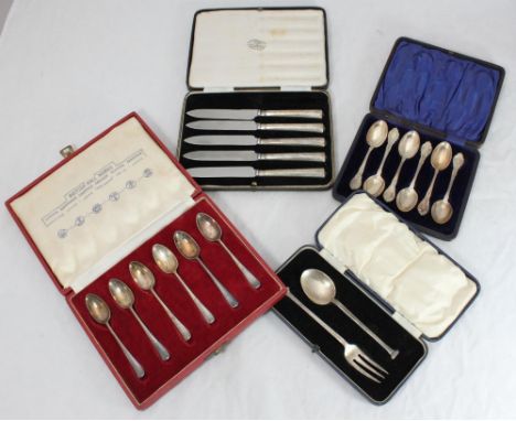 A cased silver fork and spoon, together with two various cased sets of six silver teaspoons and a cased part set of silver-ha