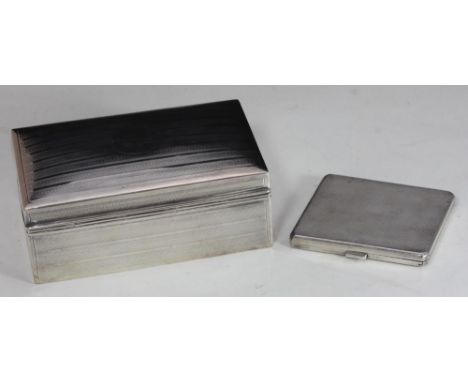 A silver rectangular cigarette box with hinged cover, engraved with reeded bands, London, 1909, maker's mark of Stuart Cliffo