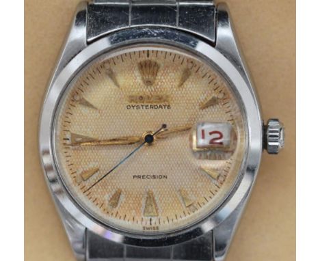 A gents stainless steel, manual wind Rolex Oysterdate Precision wristwatch, model 6294, c.1956, the ivory dial, now a natural