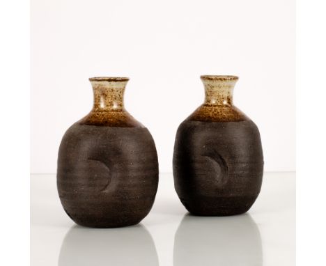 Janet Leach (American 1918-1997), a pair of ovoid bottle vases, each with cut detail to side and oxidised unglazed body, impr
