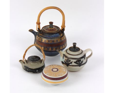 Mary Rich (British, born 1940), a porcelain teapot with cane handle, in blue with mauve and geometric gilt bands impressed ma