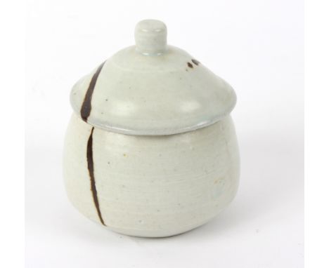 Janet Leach (American 1918-1997), a porcelain jar and cover, cream glaze with trailed decoration, impressed mark to base, 9.5