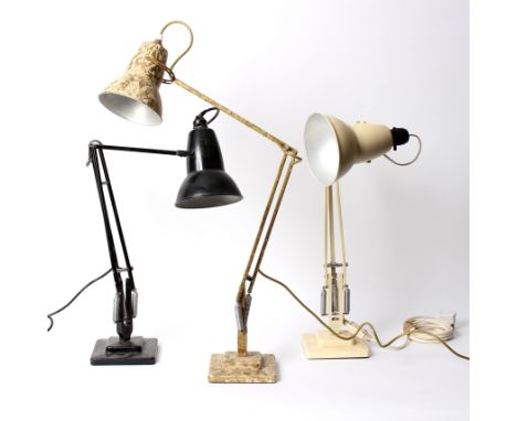 An Anglepoise lamp by Herbert Terry & Sons, Redditch, in cream, stamped to support and two others