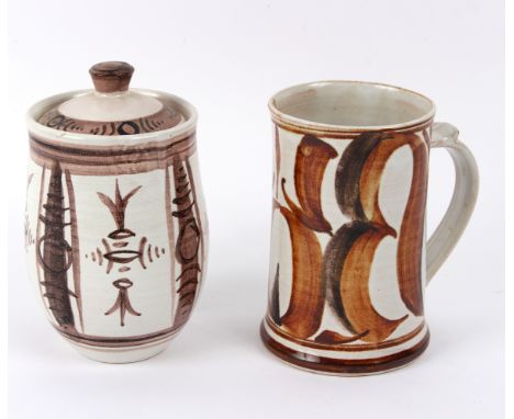 Alan Caiger-Smith (British, born 1930), a tankard with brown brush detailing to a cream ground, 14.5cm high and a similar jar