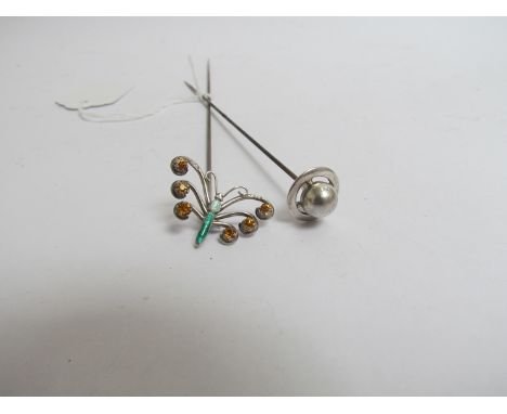 A Charles Horner silver "Saturn" hatpin and a Charles Horner silver and enamel hinged butterfly hatpin