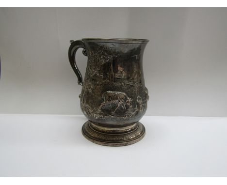 A John Payne Georgian silver tankard with embossed farmyard scenes of sheep, dog and houses, London 1767, 401g   