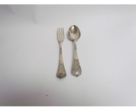 A Victorian silver fork and spoon set with decorated handles and monogrammed, Sheffield, 68g