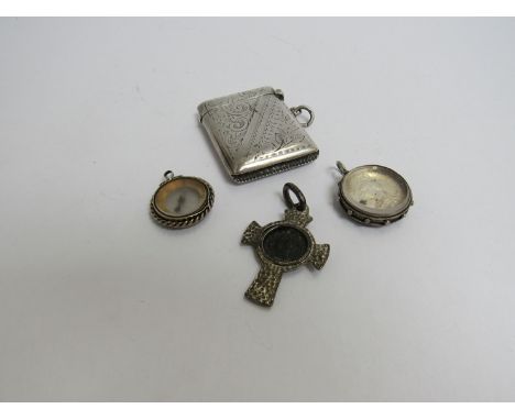 An engraved silver vesta, coin pendant, compass charm and pendant cross