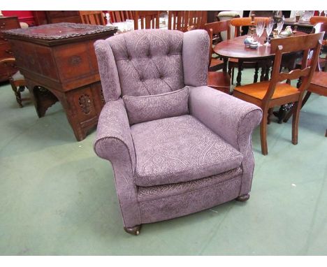 A Victorian wingback armchair, re-upholstered button back design