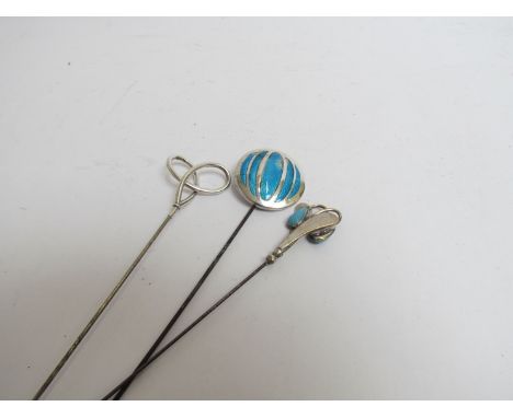 Three hatpins including two silver examples and enamel