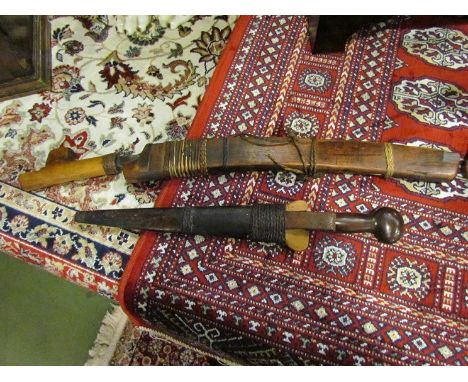 An Indonesian dagger with scabbard, possibly a spear head