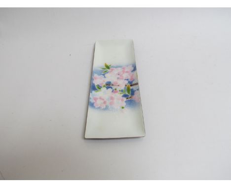A white metal and enamel cloisonne oblong tray with gently raised sides, white ground decorated with pale pink cherry blossom